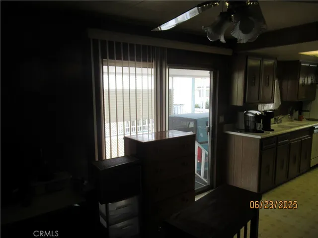 a kitchen with a refrigerator and a stove
