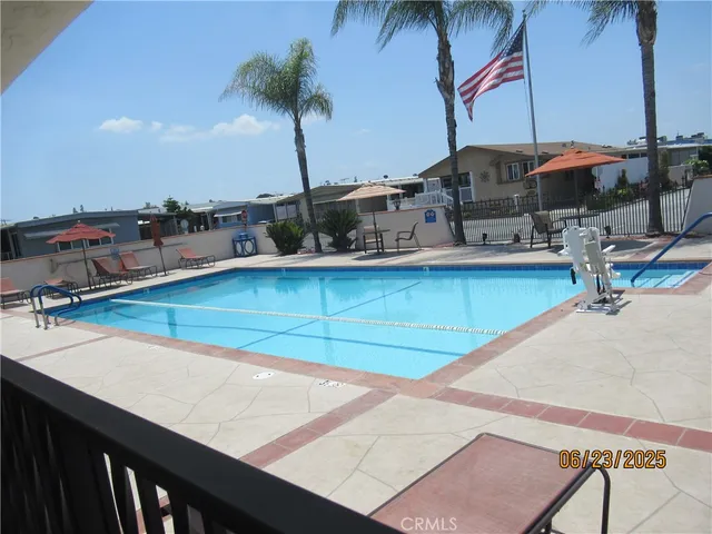 a view of a swimming pool with a table and chairs
