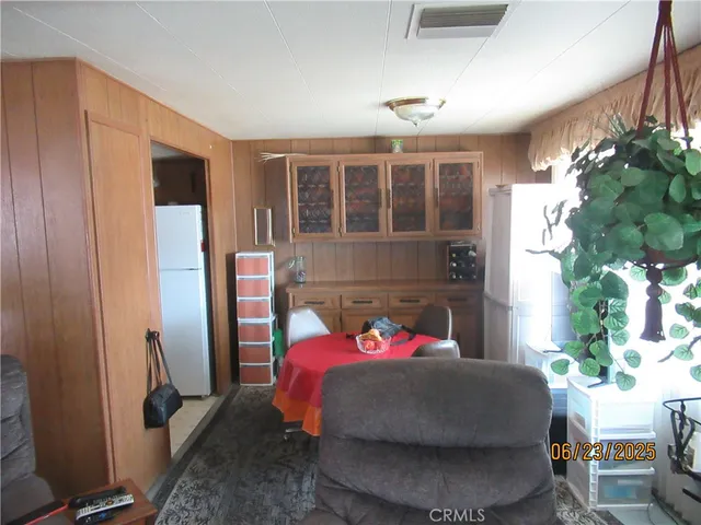a bedroom with furniture and a potted plant