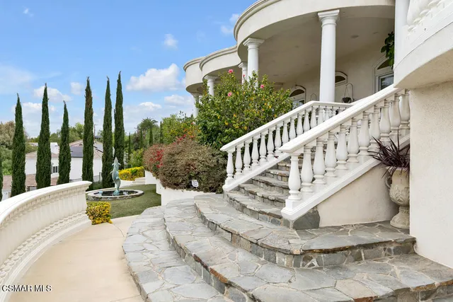 a bathroom with a granite countertop shower mirror and a sink