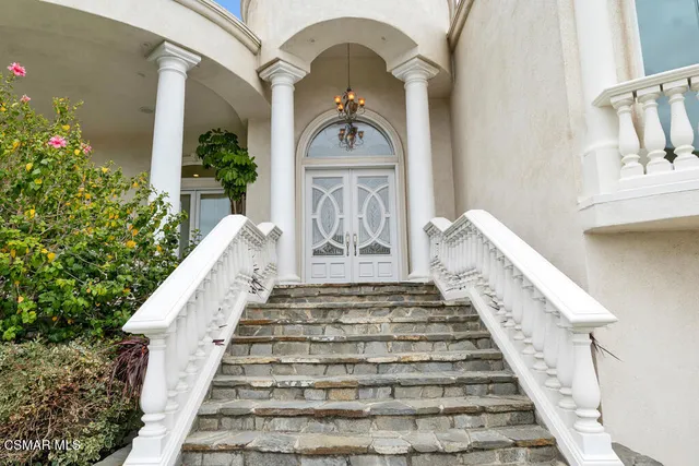 a view of a hallway with paintings on the wall