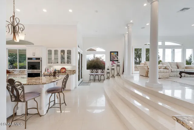 a bathroom with a toilet and a shower curtain