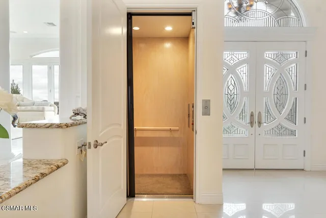 a front view of a house with a yard table and chairs