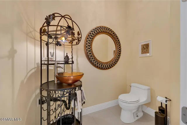 an aerial view of a house with a yard and lake view