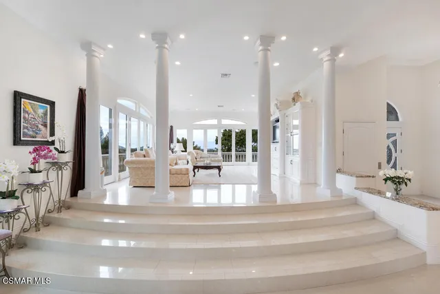 a view of balcony with furniture