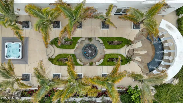 a view of a dining room with furniture and a chandelier