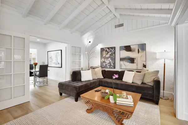 a living room with furniture and a rug