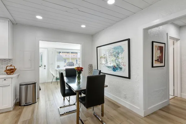 a view of a livingroom with furniture wooden floor and window