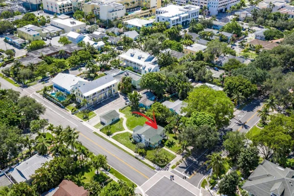 an aerial view of residential house with outdoor space and swimming pool