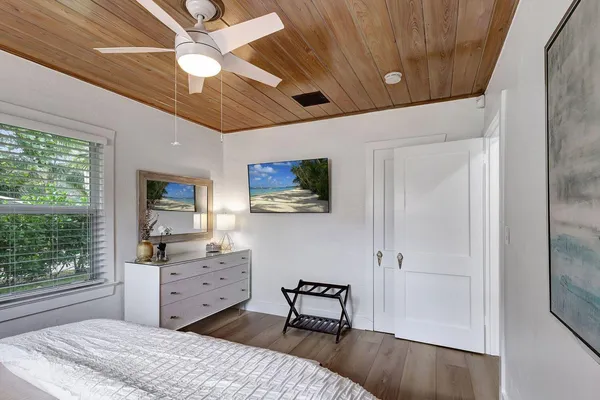 a bedroom with furniture and a window