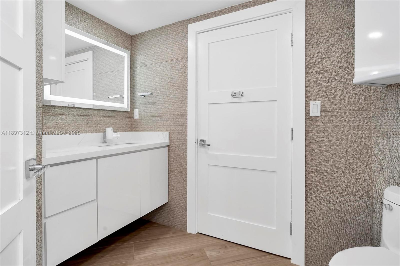 9066 Southwest 73rd Court, Unit 2110 Miami, FL 33156 - Photo 25 of 45 a bathroom with a sink and mirror