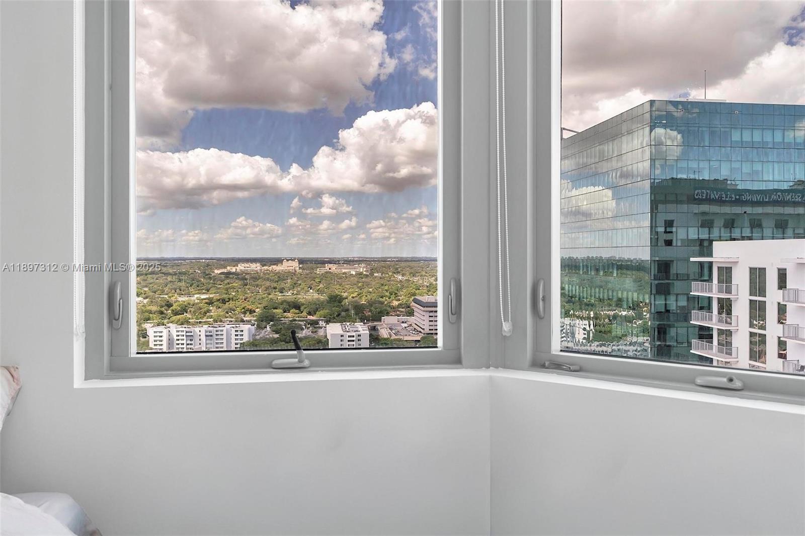 9066 Southwest 73rd Court, Unit 2110 Miami, FL 33156 - Photo 28 of 45 a view of a blue sky from a balcony