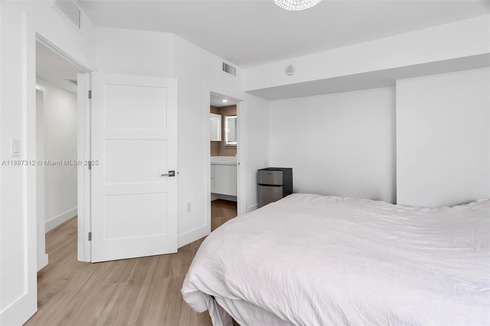 9066 Southwest 73rd Court, Unit 2110 Miami, FL 33156 - Photo 29 of 45 a large white bed in a white room