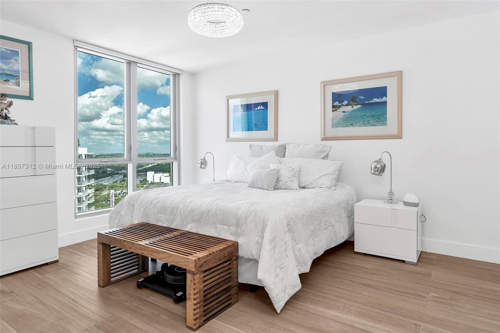 9066 Southwest 73rd Court, Unit 2110 Miami, FL 33156 - Photo 30 of 45 a bedroom with a bed and a large window