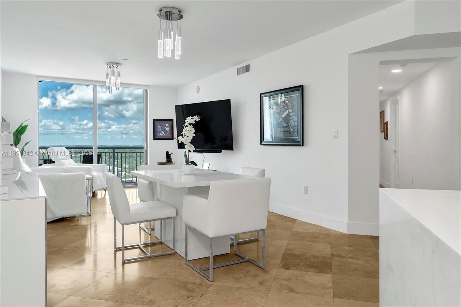 9066 Southwest 73rd Court, Unit 2110 Miami, FL 33156 - Photo 3 of 45 a view of a livingroom with furniture and a mirror