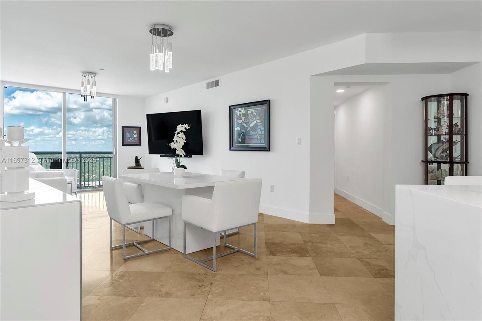 9066 Southwest 73rd Court, Unit 2110 Miami, FL 33156 - Photo 4 of 45 a view of a dining room with furniture and window