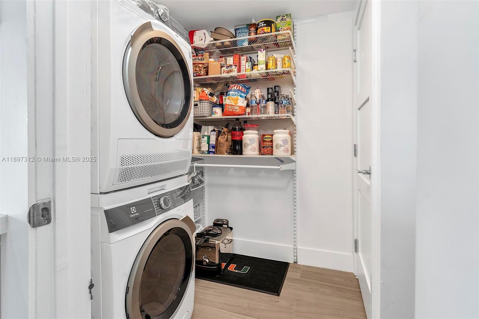 9066 Southwest 73rd Court, Unit 2110 Miami, FL 33156 - Photo 10 of 45 a room with storage and utility