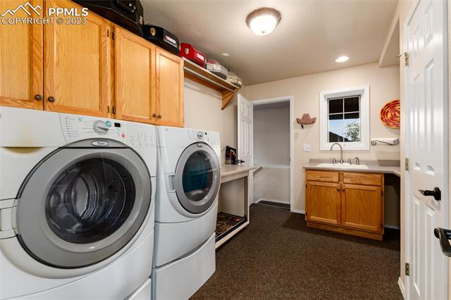 16850 Steppler Road Colorado Springs, CO 80908 - Photo 17 of 36 Laundry/mud room off garage with lots of storage.