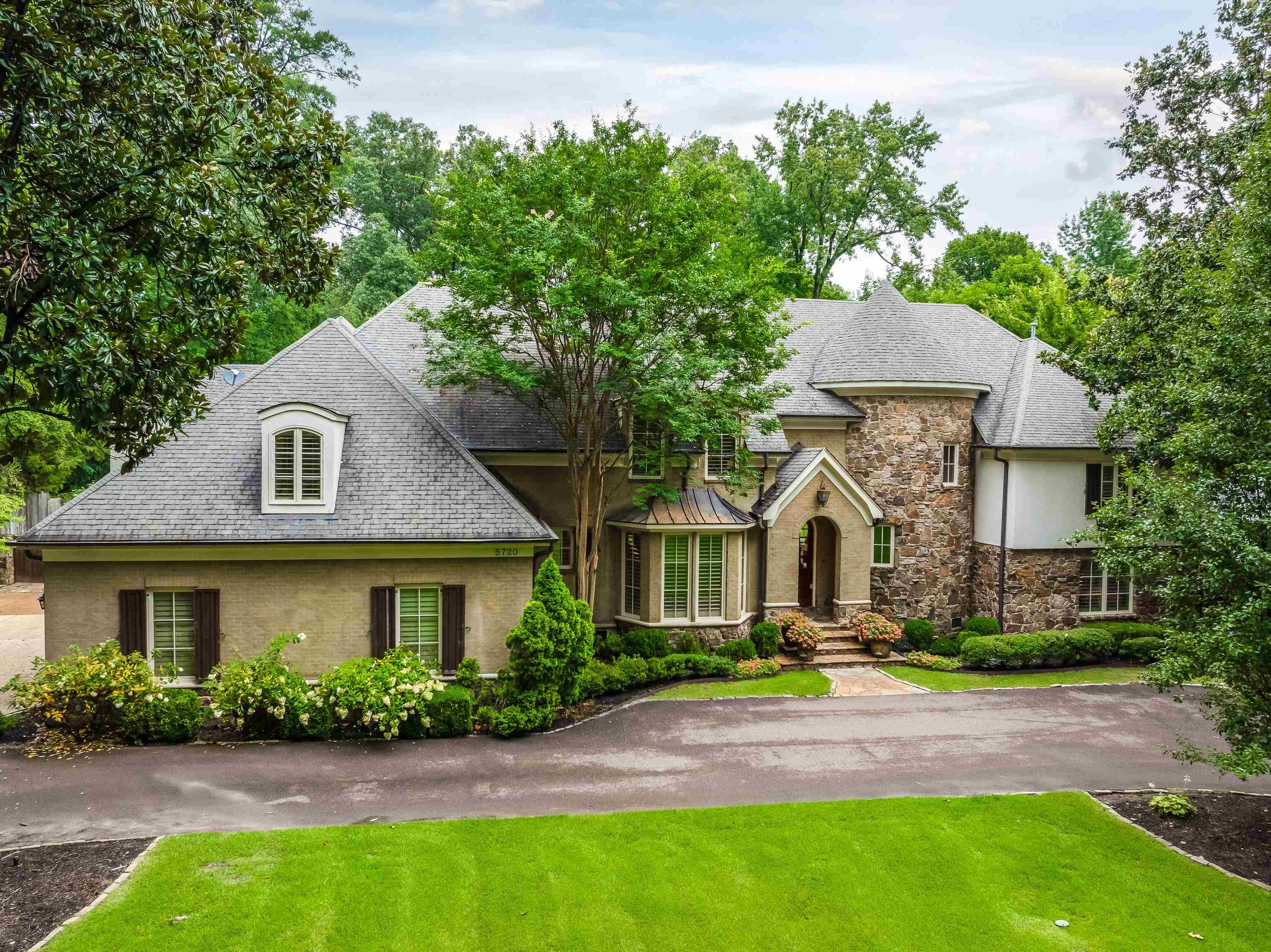 5720 Shady Grove Road Memphis, TN 38120 - Photo 1 of 40 a front view of a house with a yard and outdoor seating