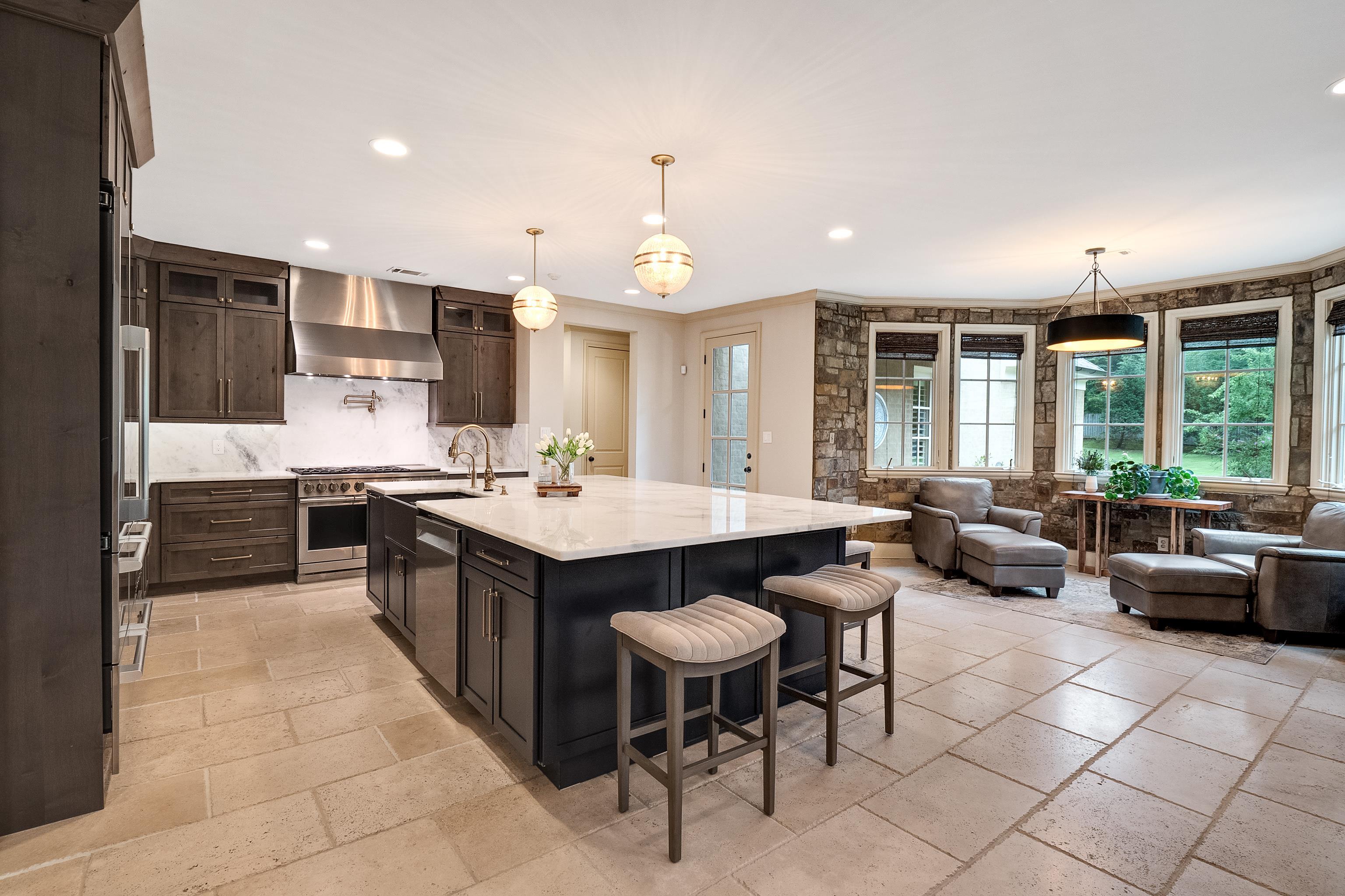 5720 Shady Grove Road Memphis, TN 38120 - Photo 11 of 40 a kitchen with granite countertop a sink and a stove