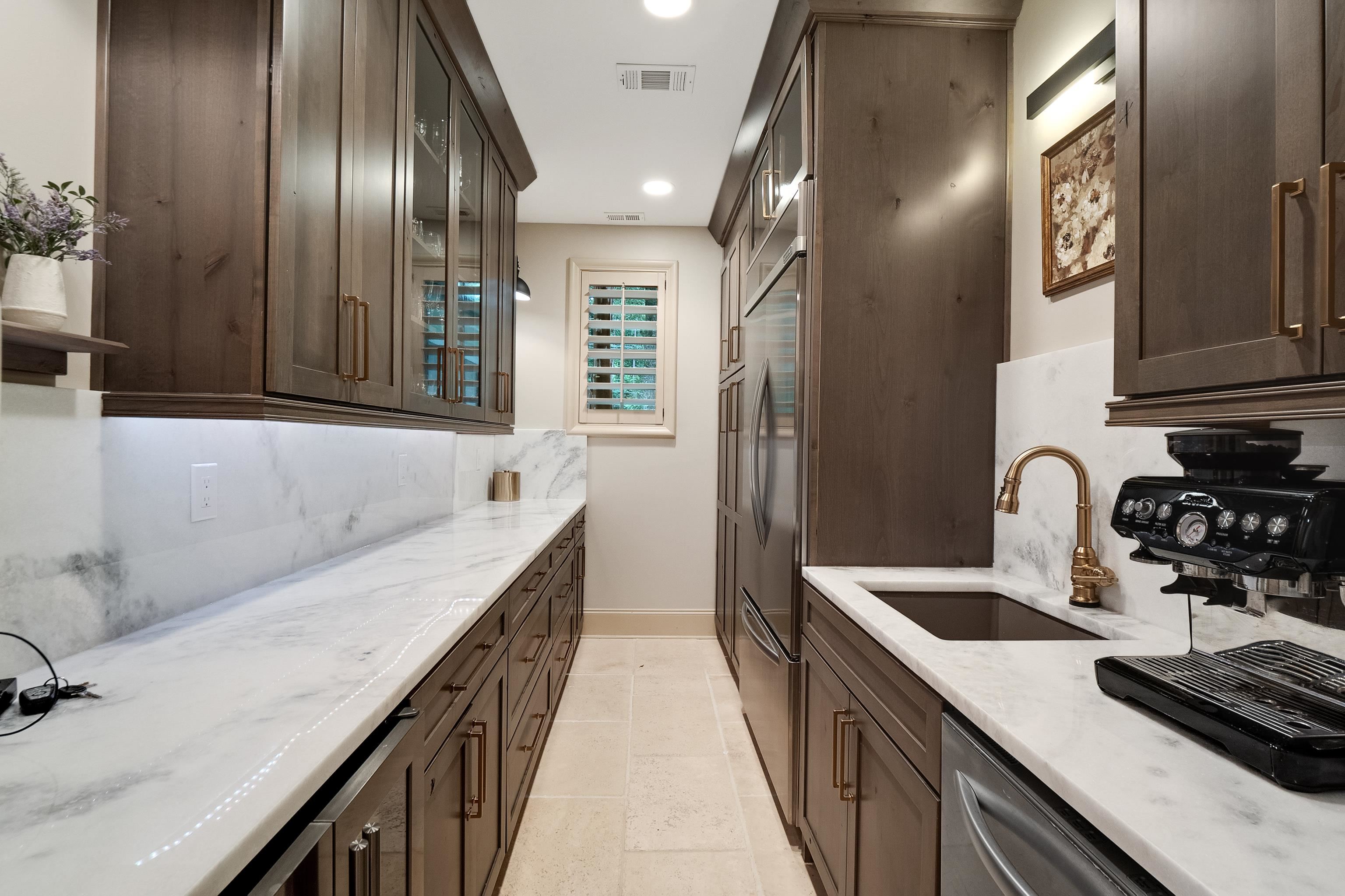 5720 Shady Grove Road Memphis, TN 38120 - Photo 15 of 40 a kitchen with a sink and a refrigerator