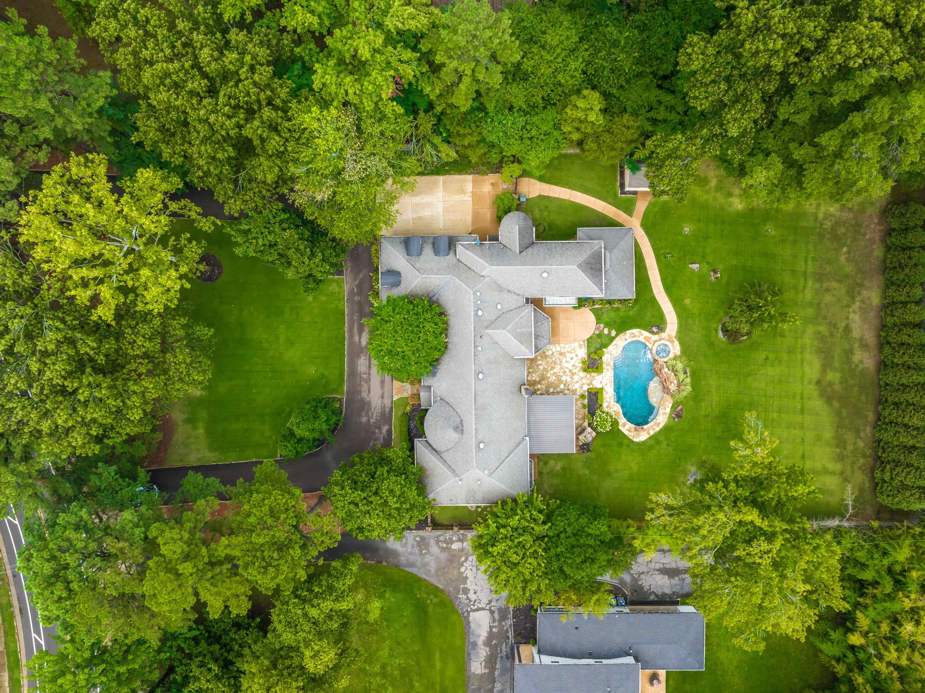 5720 Shady Grove Road Memphis, TN 38120 - Photo 2 of 40 an aerial view of a house with a yard and outdoor seating