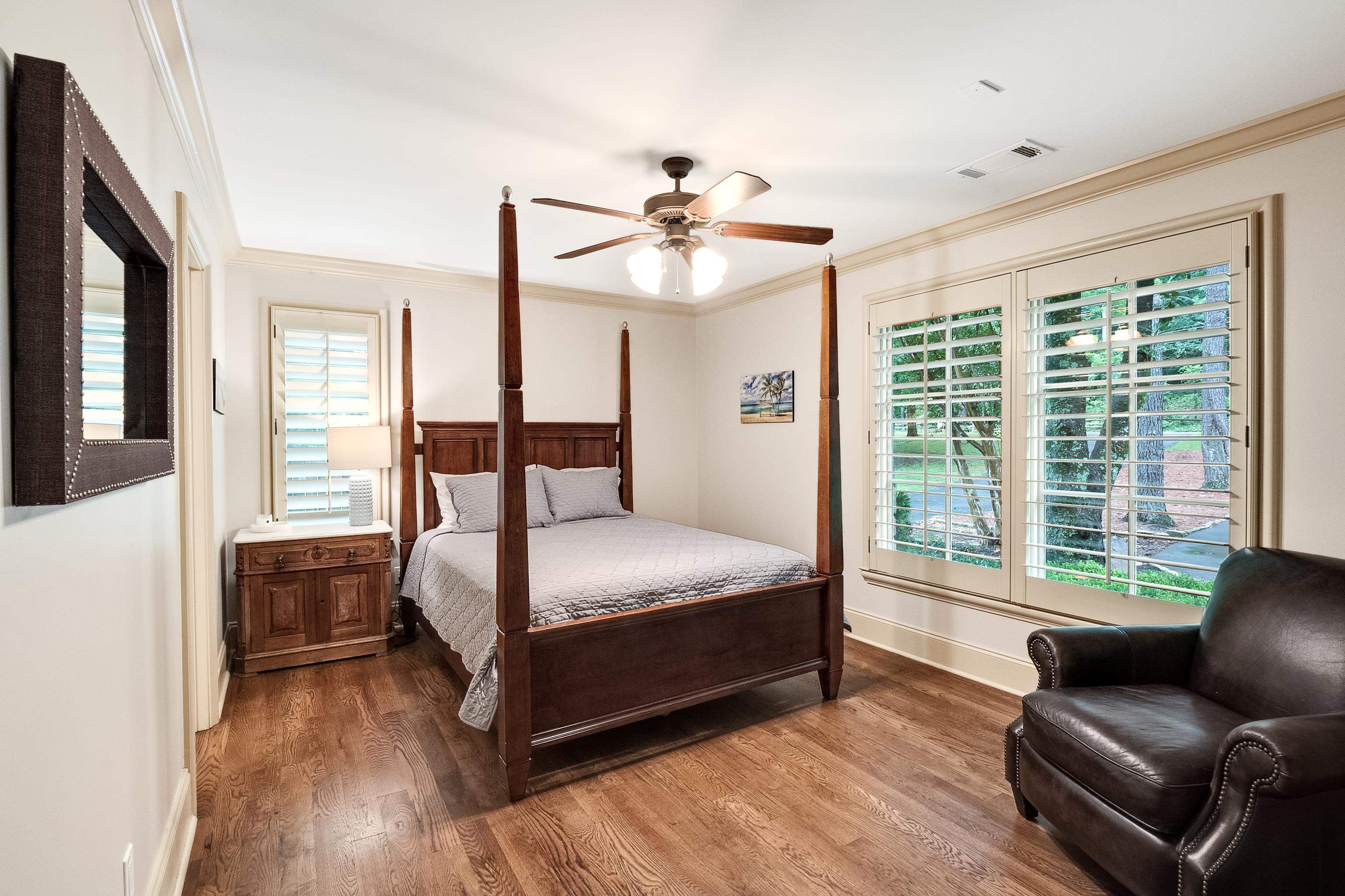 5720 Shady Grove Road Memphis, TN 38120 - Photo 22 of 40 a bedroom with a bed couch and a large window