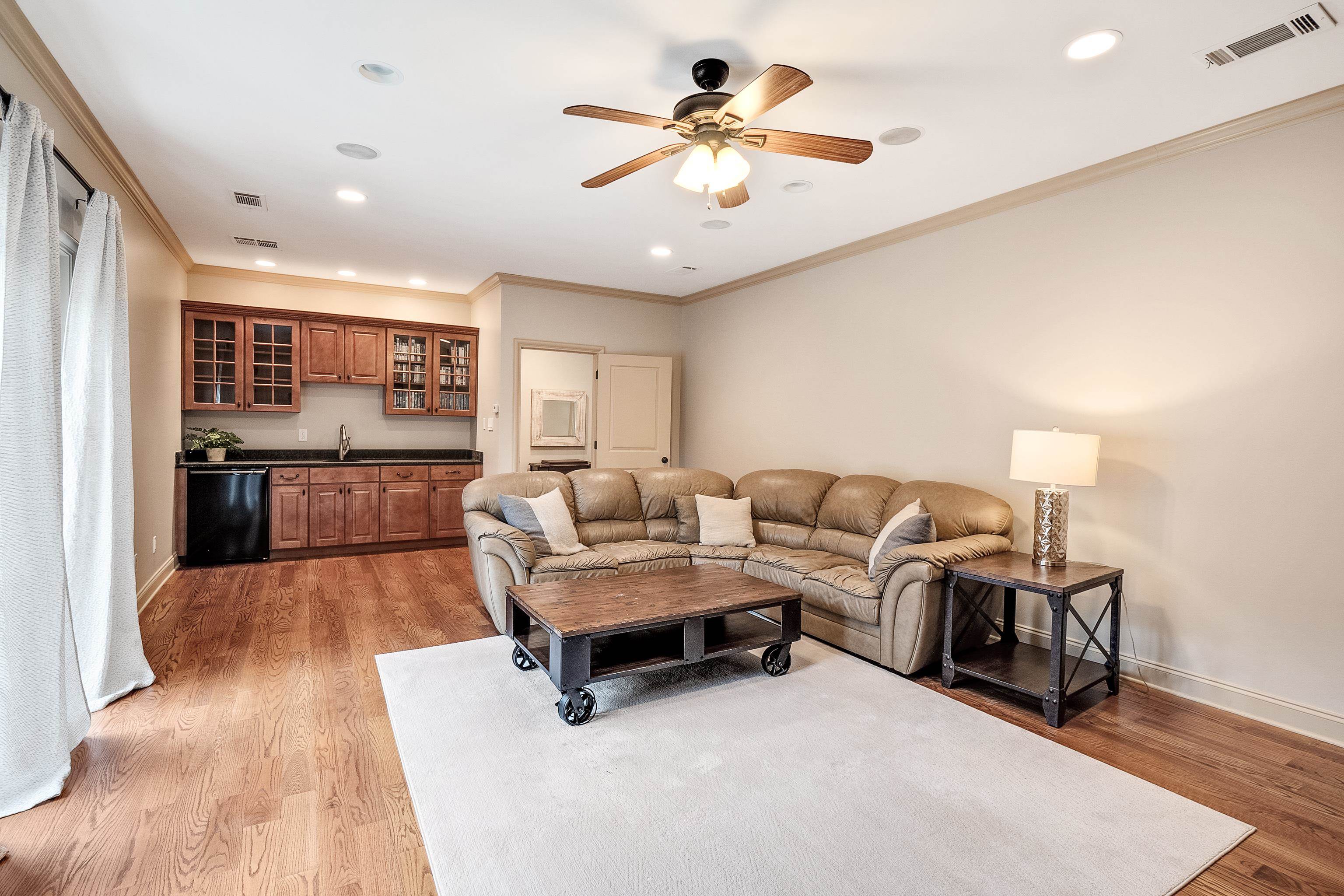 5720 Shady Grove Road Memphis, TN 38120 - Photo 30 of 40 a living room with furniture and a chandelier