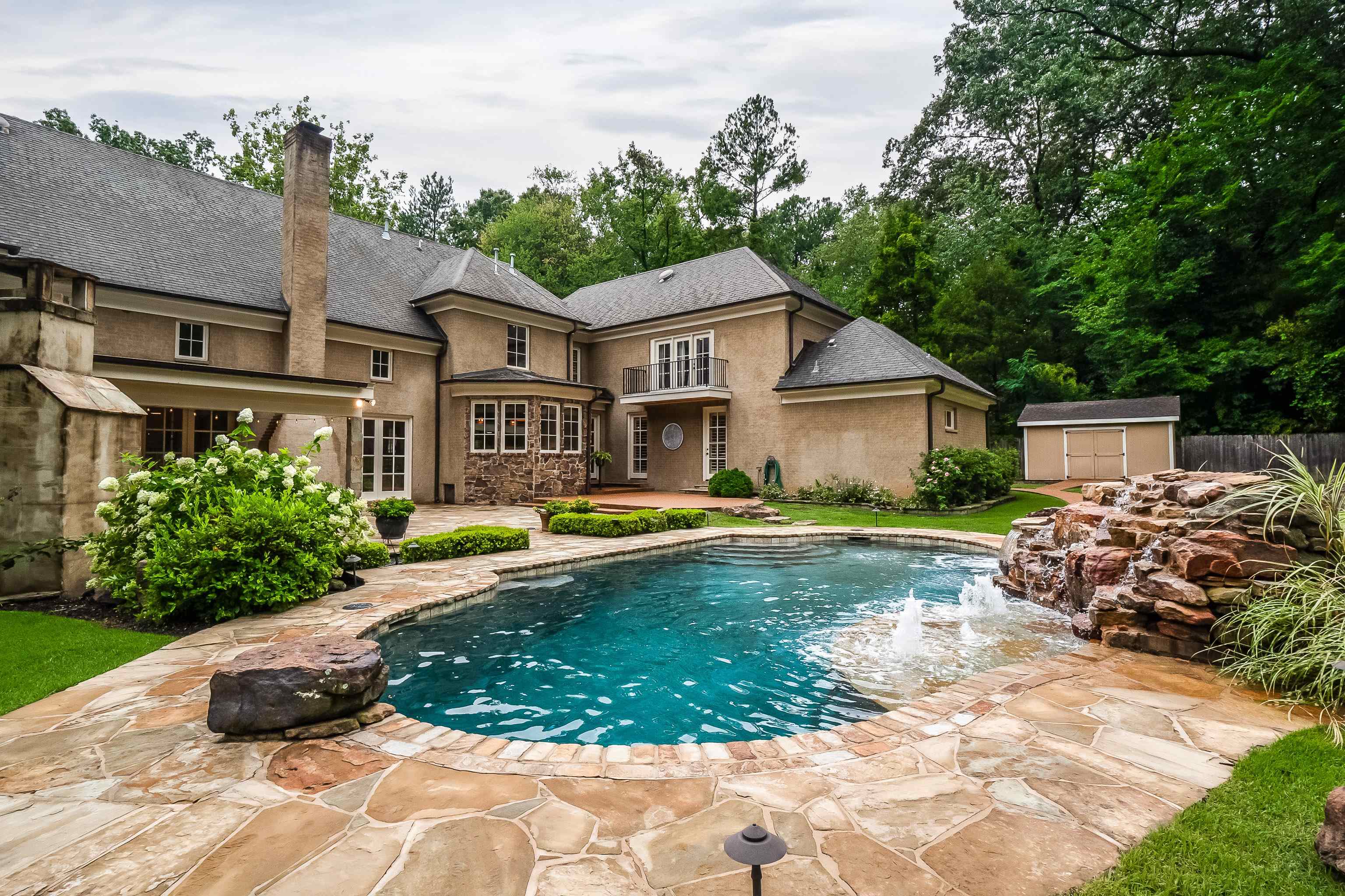 5720 Shady Grove Road Memphis, TN 38120 - Photo 35 of 40 a view of a house with swimming pool and sitting area