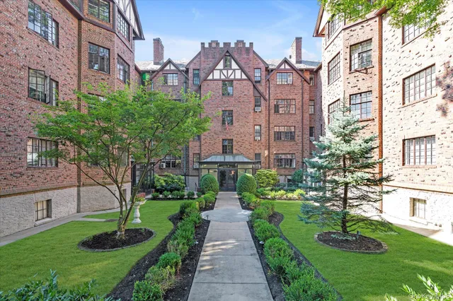 a front view of a building with garden