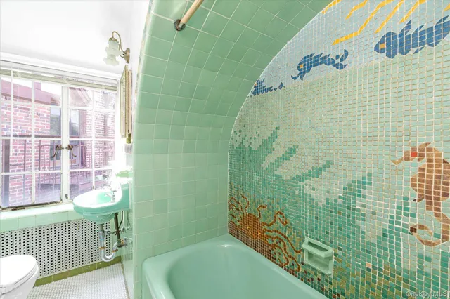 a bathroom with a bathtub and shower