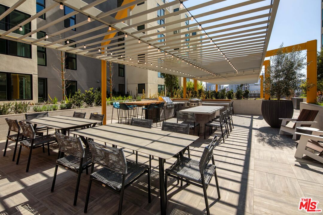 1101 North Main Street, Unit C450 Los Angeles, CA 90012 - Photo 25 of 35 a view of a table and chairs in the patio