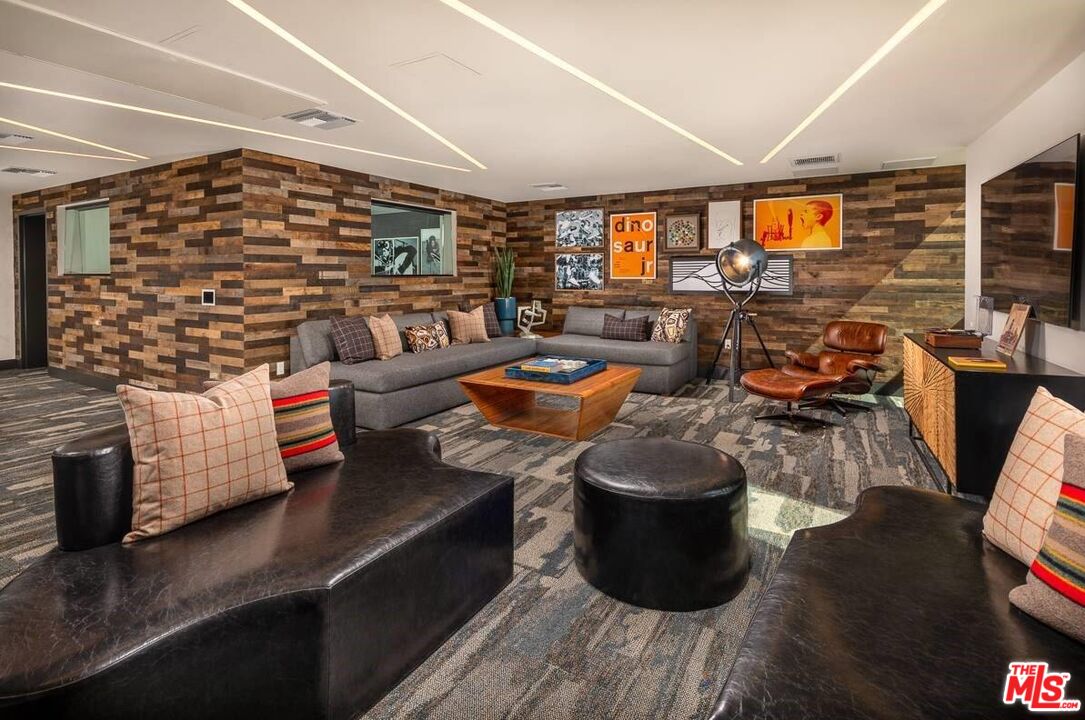 1101 North Main Street, Unit C450 Los Angeles, CA 90012 - Photo 29 of 35 a living room with furniture and a flat screen tv