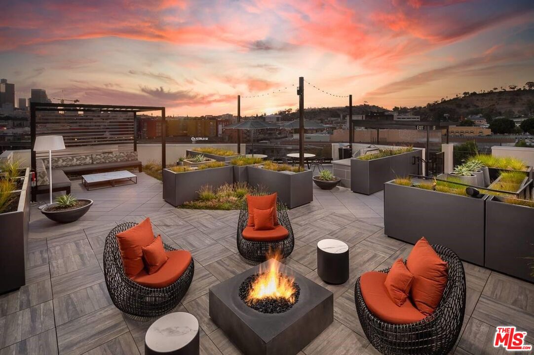1101 North Main Street, Unit C450 Los Angeles, CA 90012 - Photo 30 of 35 a outdoor living space with furniture and a garden