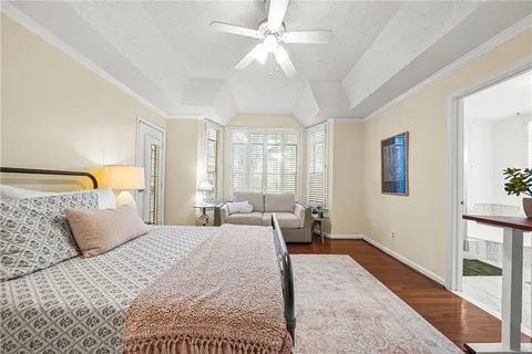 a bedroom with a large bed and a couch