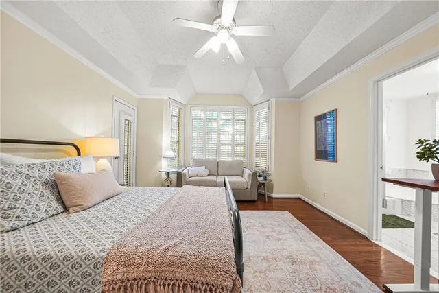 a bedroom with a large bed and a couch