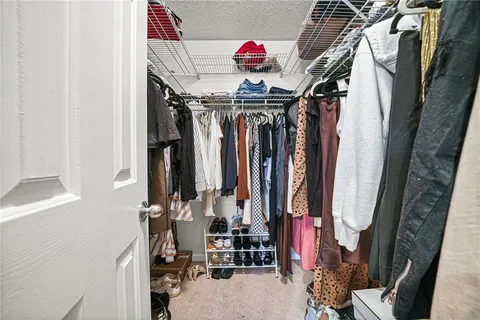 a bathroom with a toilet sink double vanity and mirror