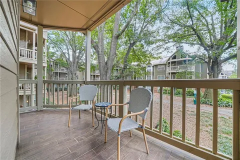 a front view of a house with yard and green space