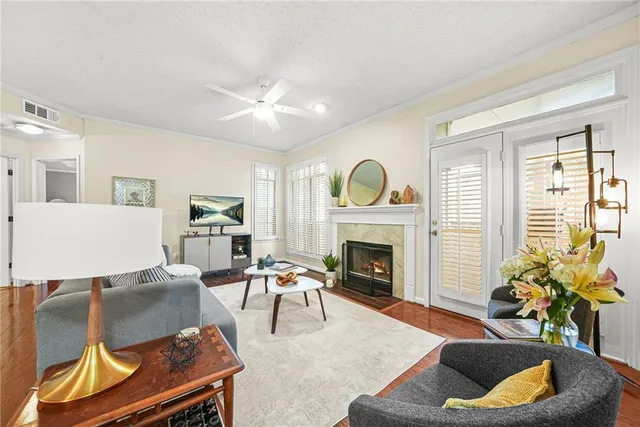 a living room with furniture and a fireplace