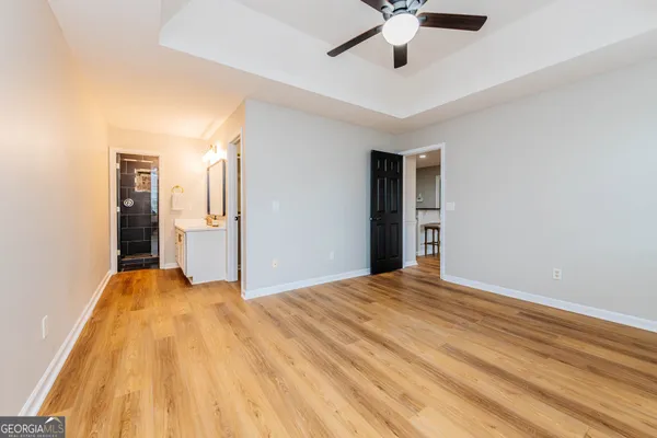 a view of a livingroom with a chandelier fan