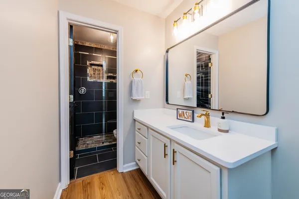 a bathroom with a sink and a mirror