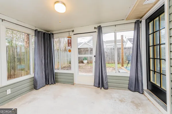 a view of room with window and floor to ceiling window