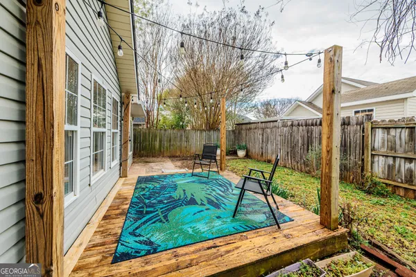 a view of balcony with two chairs and a table