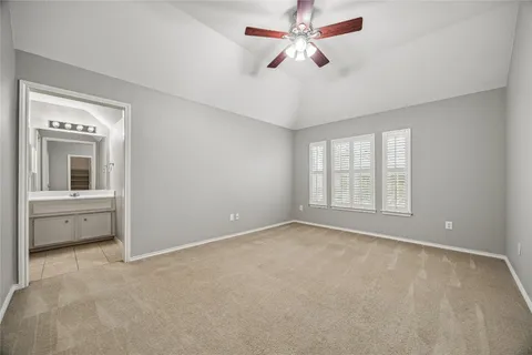 an empty room with a empty space and a ceiling fan