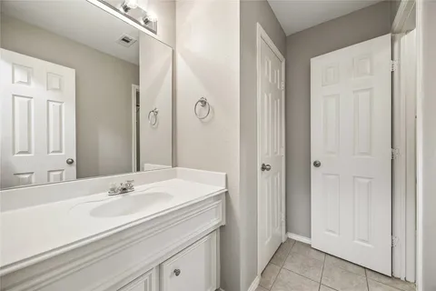 a view of a house with a swimming pool and a backyard