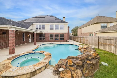 a view of a swimming pool with a seating space