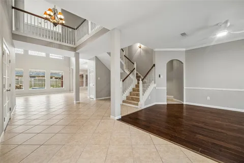 a view of an entryway with wooden floor