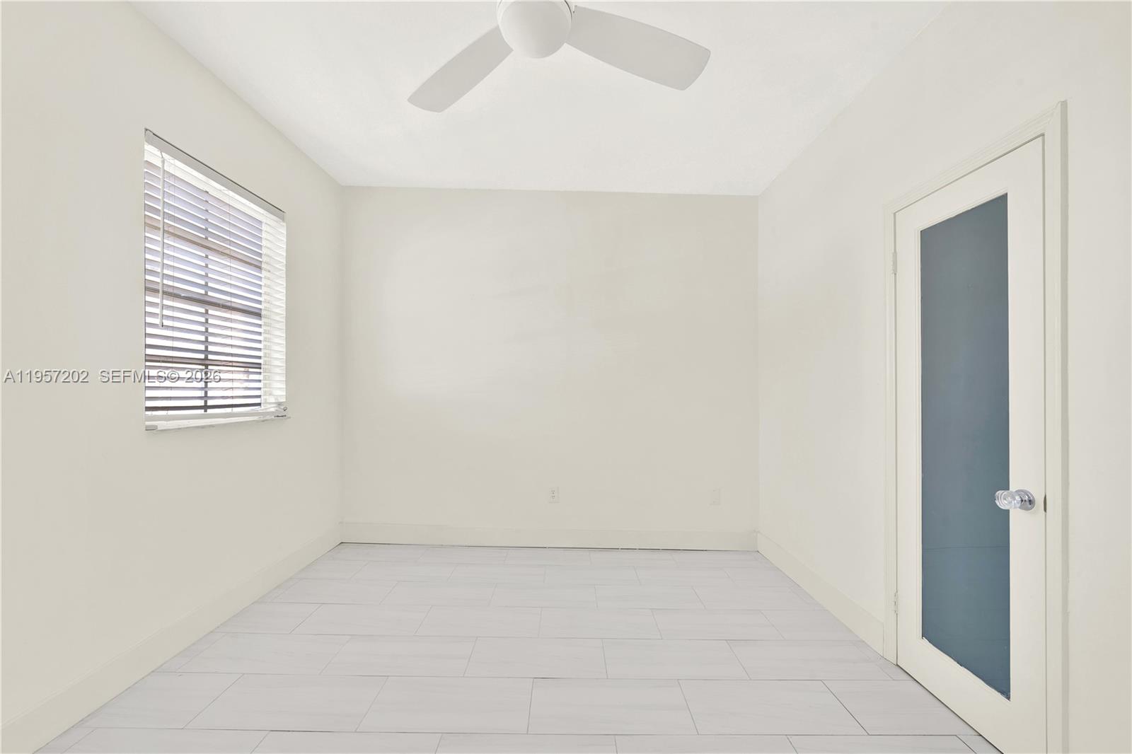 610 8th Street Miami Beach, FL 33139 - Photo 21 of 22 an empty room with windows