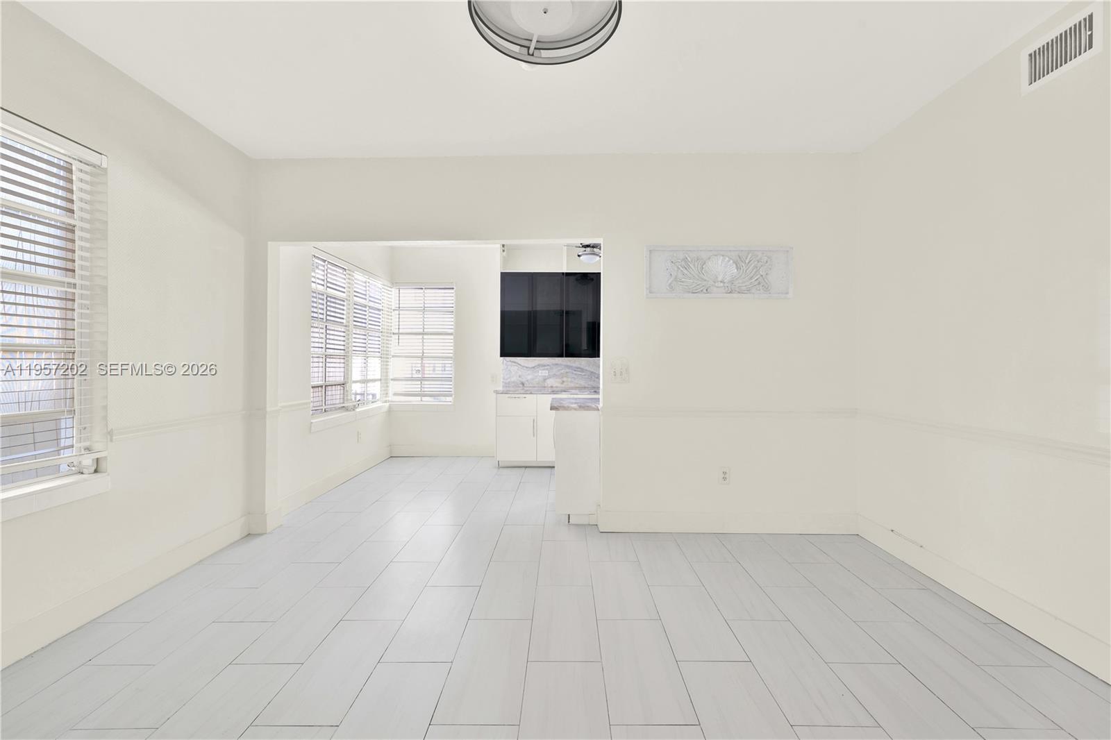 610 8th Street Miami Beach, FL 33139 - Photo 7 of 22 an empty room with windows