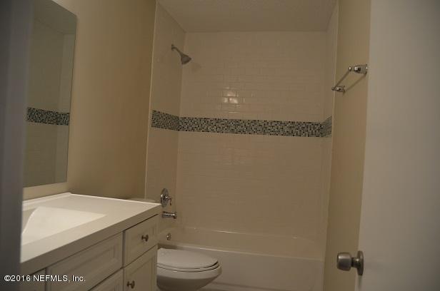 10982 Reading Road Jacksonville, FL 32257 - Photo 18 of 27 a bathroom with a granite countertop sink mirror vanity and toilet